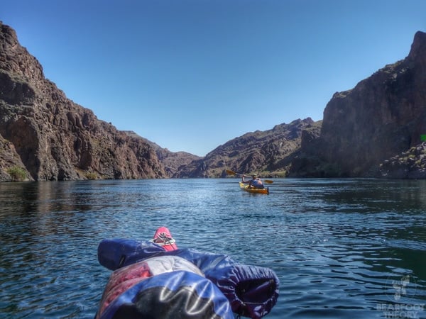 Kayak loaded with camping gear heading down the Black Canyon on the Colorado River