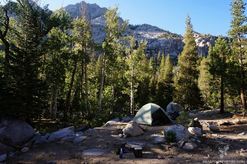 A backpacking tent is set up near Woods Creek Junction on the JMT