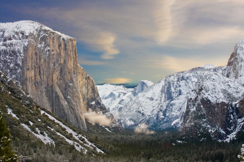 Landscape view of El Capitan in Yosemite National Park in winter with snow dusting the mountains