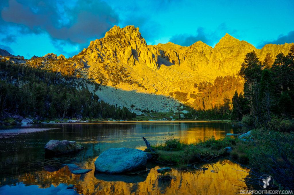 Flower Lakes at sunrise. The sun reflects on the granite mountain in the background