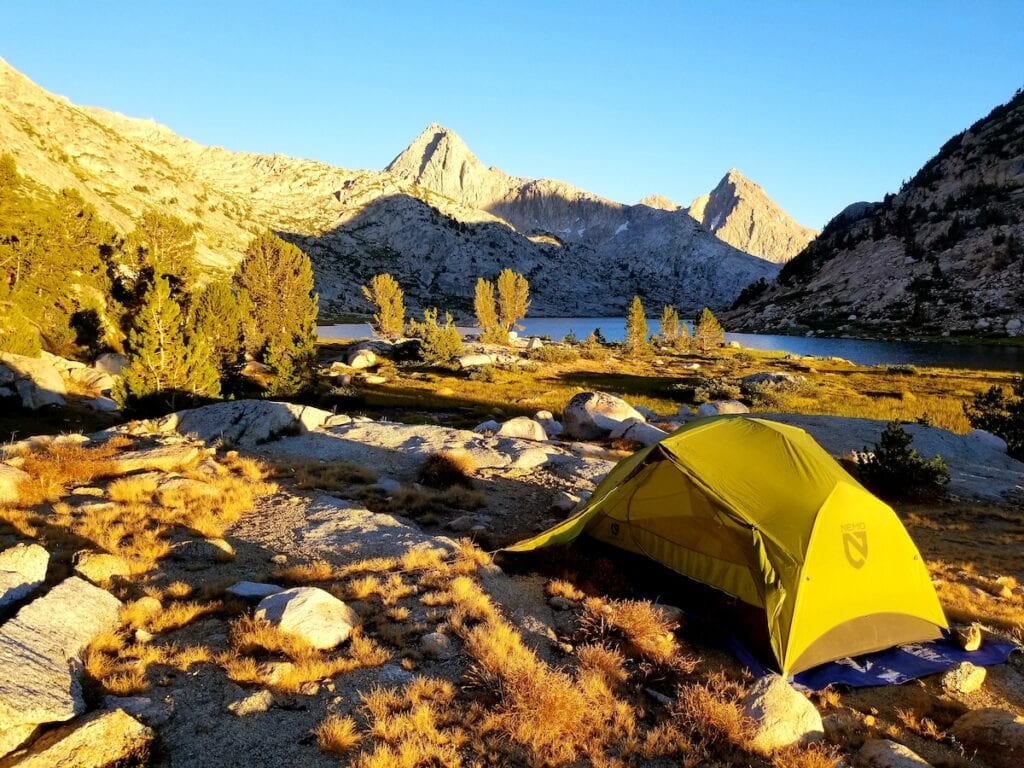 A NEMO Hornet 2 backpacking tent set up at Evolution Lake on the John Muir Trail