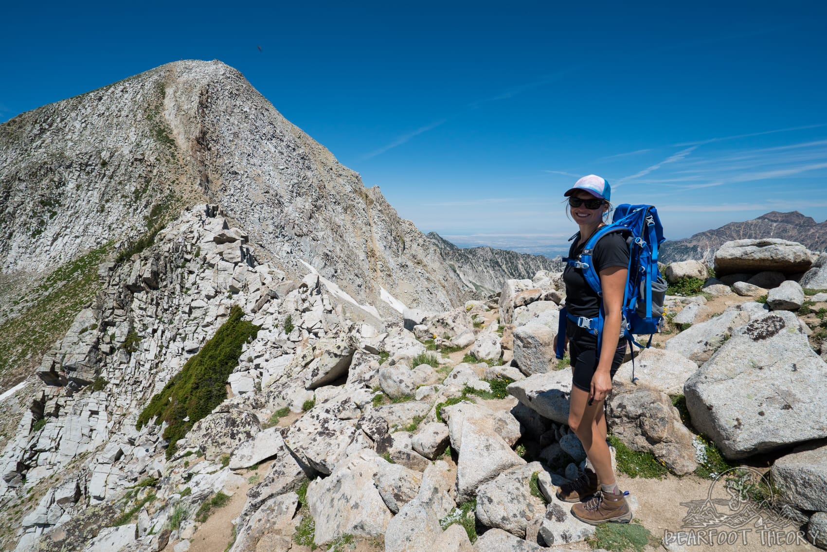 Woman paused on trail on the Pfeifferhorn, the third tallest peak near Salt Lake City