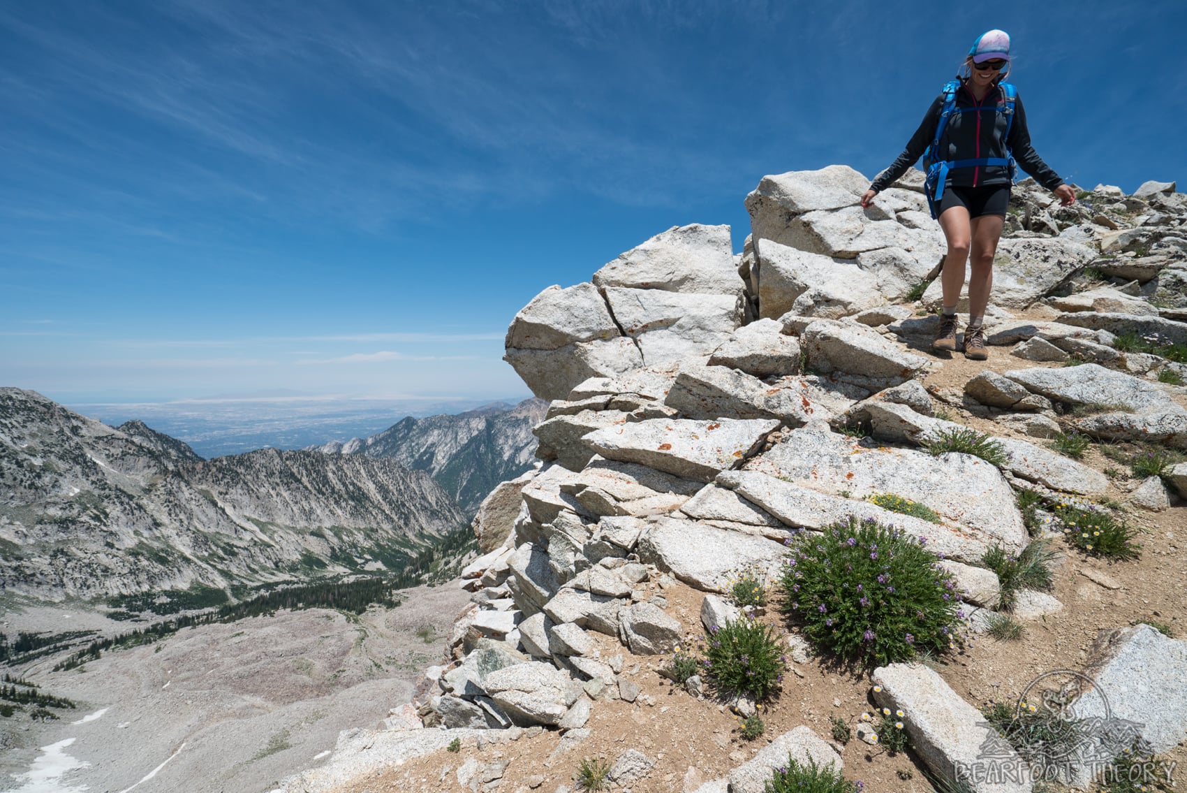 Hiker on the summit of the Pfeifferhorn, the third tallest peak near Salt Lake City in the Wasatch Mountain Range