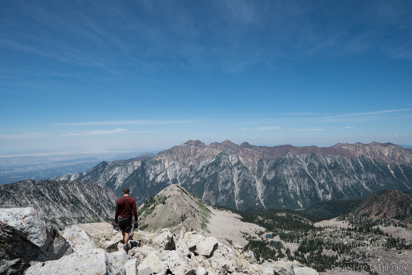 Hiker at the summit of the Pfeifferhorn, the third tallest peak near Salt Lake City in the Wasatch Mountain Range