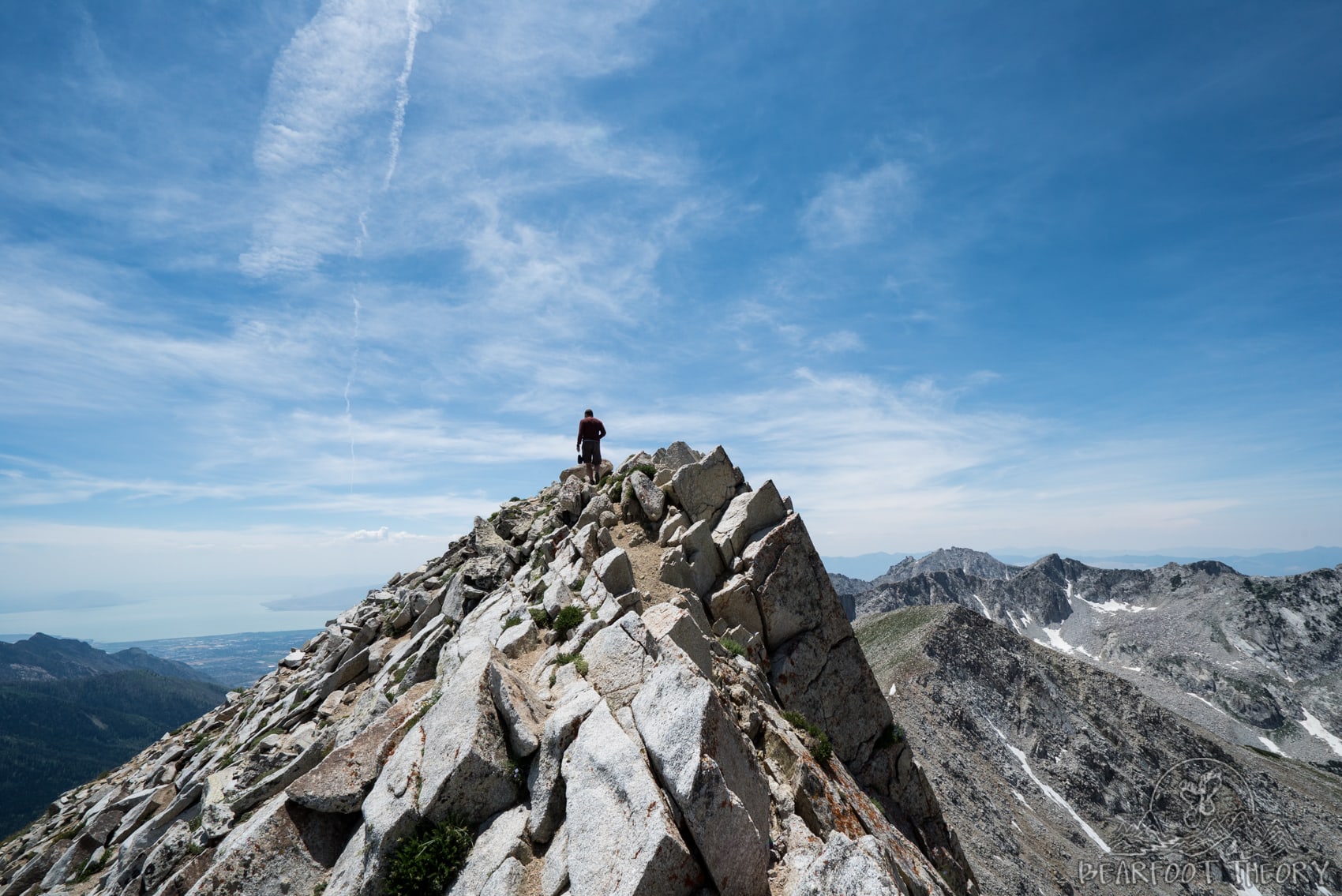 Hiker on the Pfeifferhorn summit, the third tallest peak near Salt Lake City in the Wasatch Mountain Range