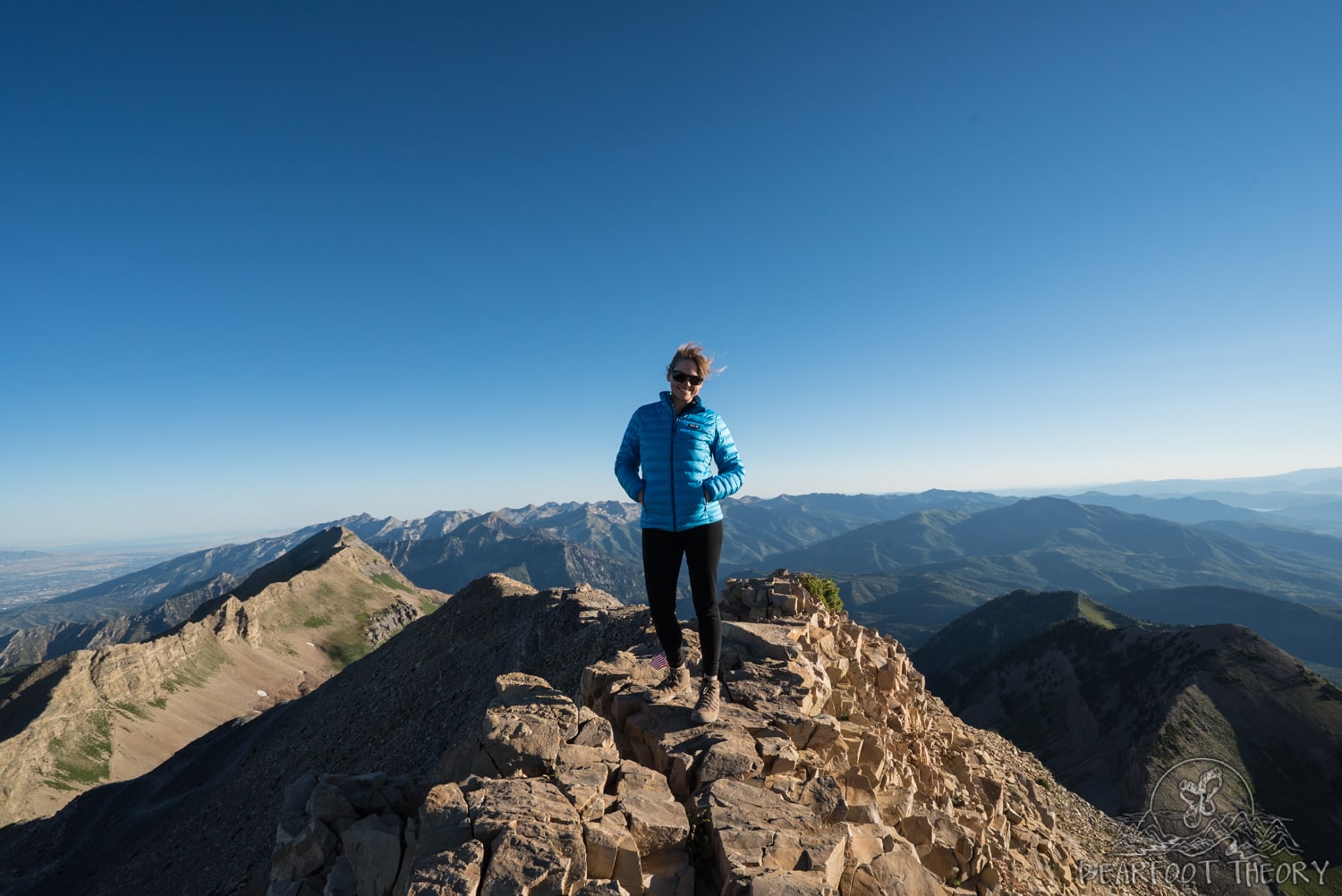 Kristen standing on Mount Timpanogos summit