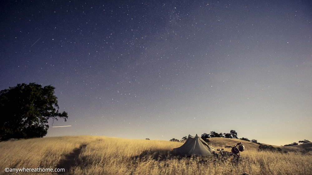 a backpacking tent in high grass under the stars in Henry W Coe State Park