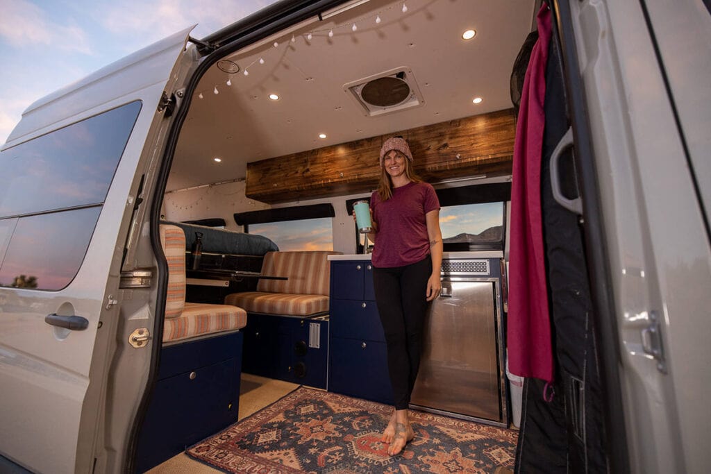 Kristen in her Sprinter van // Learn about Progressive RV insurance including what vehicles are covered, different coverage options, & tips for insuring your camper van.