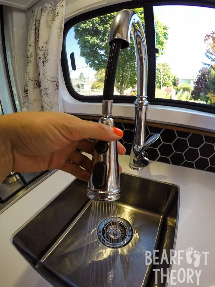 The stainless steel sink and faucet in my firsy 4x4 Sprinter Camper Van Conversion. Get more info in this detailed blog post.