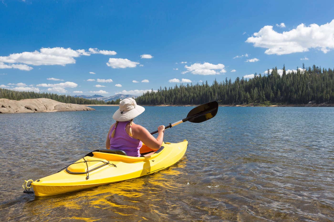 Woman kayaking on lake in Montana