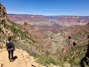 Hiker looking out over Grand Canyon views on the Bright Angel Trail