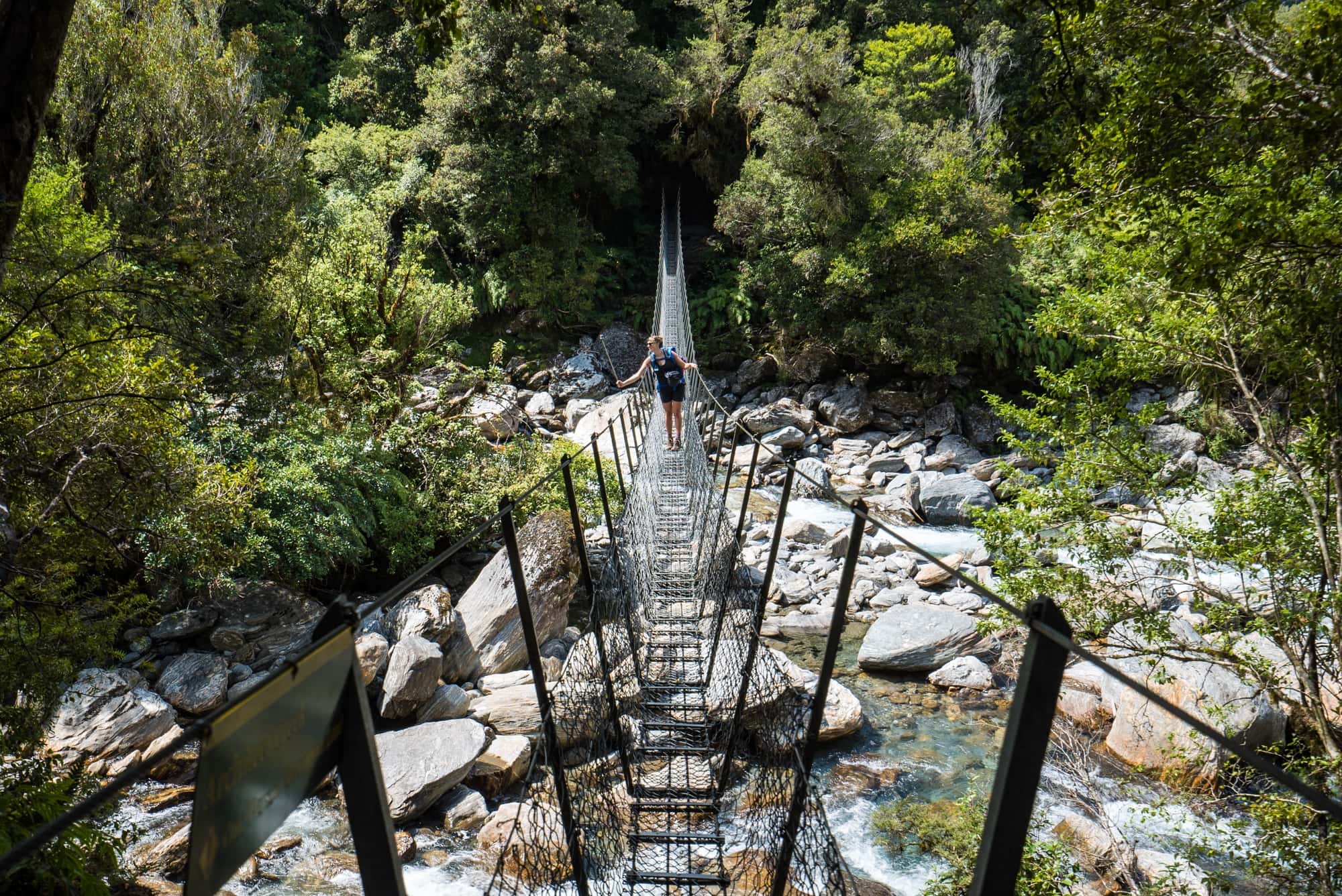 The Copland Track on New Zealand's South Island is an incredible overnight backpacking trek with dense forest, glacier rivers, alpine views, and HOT SPRINGS! See the pics and learn how to plan this must-do trek with this backpacking guide!