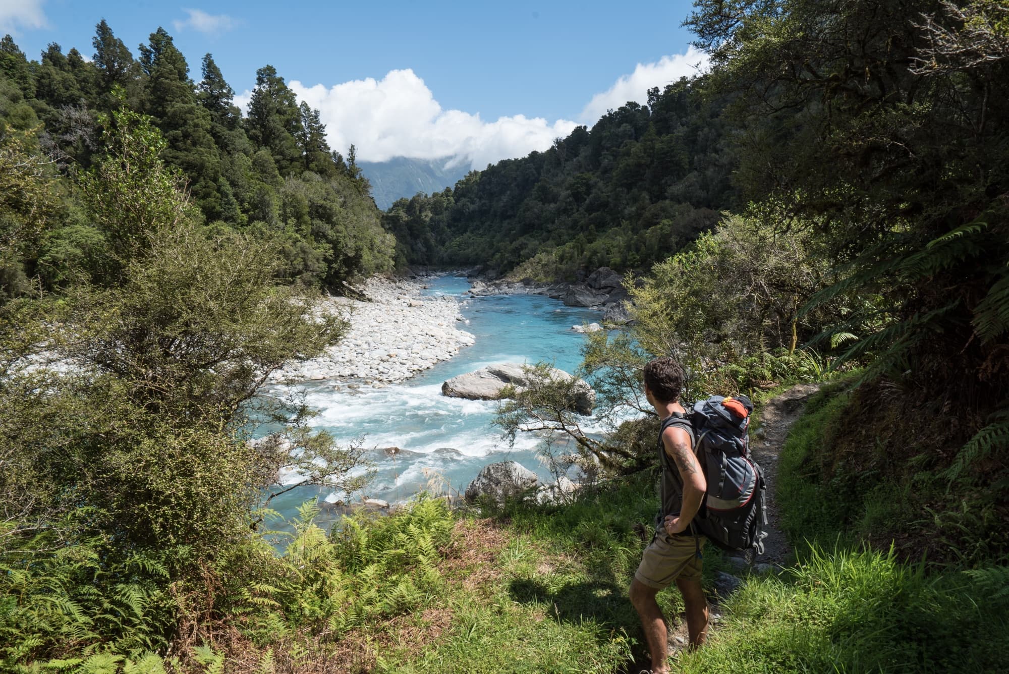 The Copland Track on New Zealand's South Island is an incredible overnight backpacking trek with dense forest, glacier rivers, alpine views, and HOT SPRINGS! See the pics and learn how to plan this must-do trek with this backpacking guide!