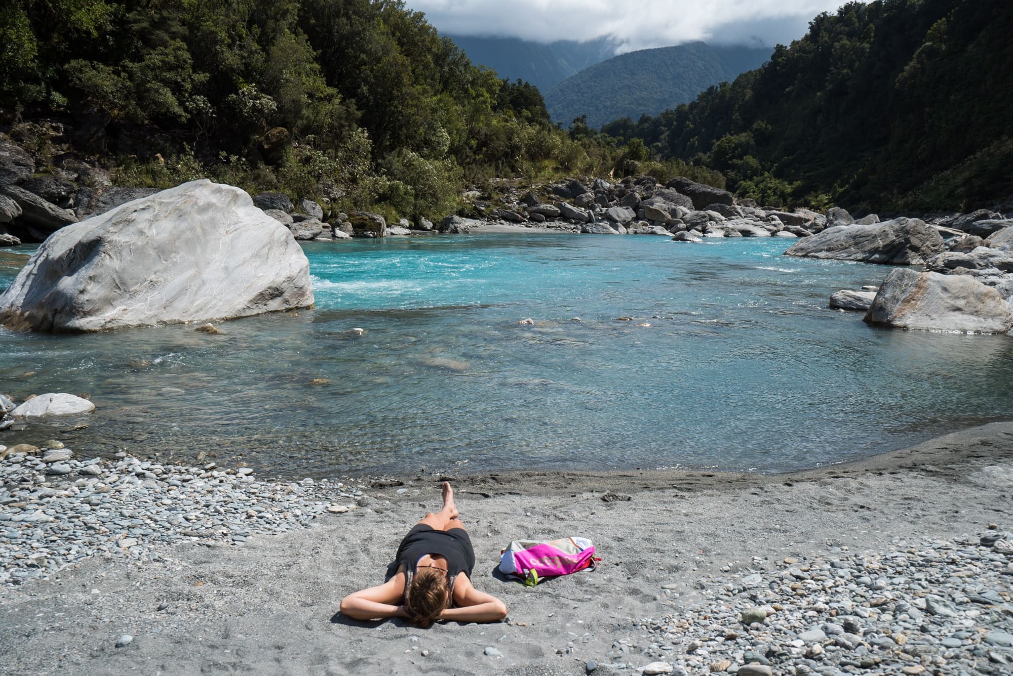 The Copland Track on New Zealand's South Island is an incredible overnight backpacking trek with dense forest, glacier rivers, alpine views, and HOT SPRINGS! See the pics and learn how to plan this must-do trek with this backpacking guide!