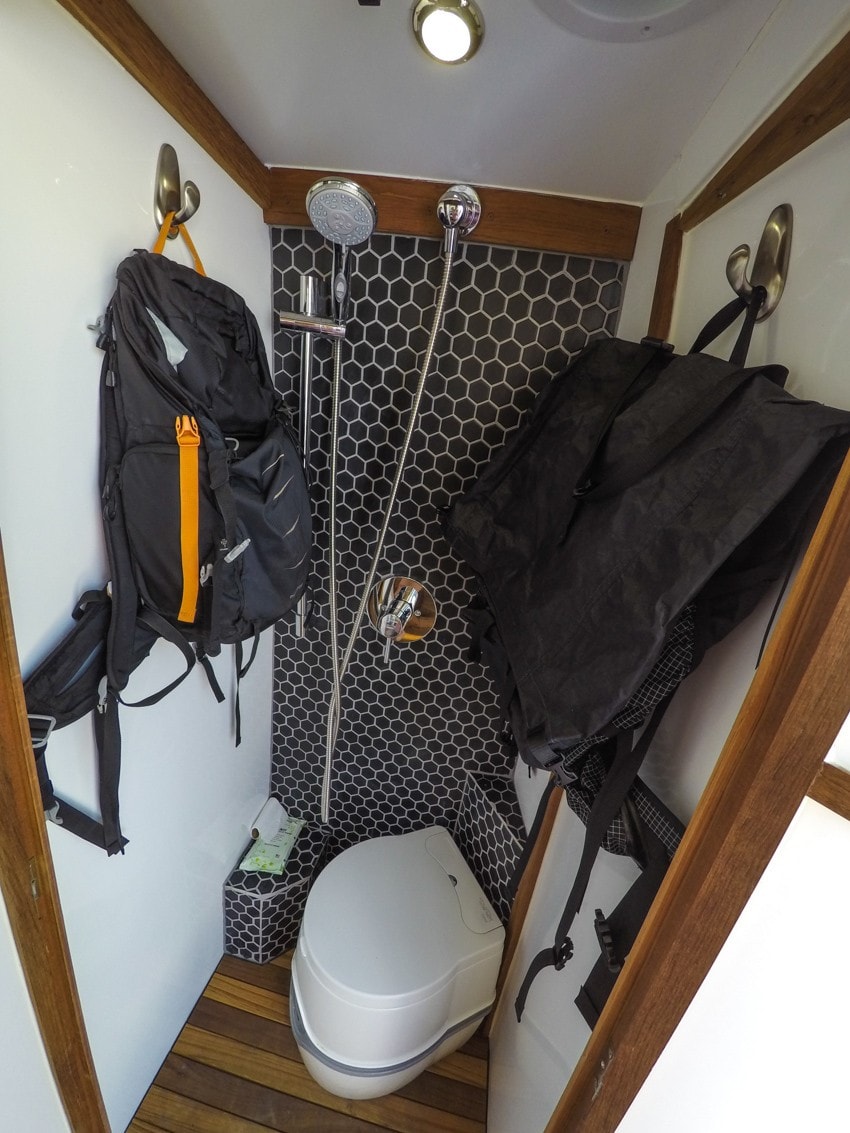Converted Sprinter van shower being used as a gear closet