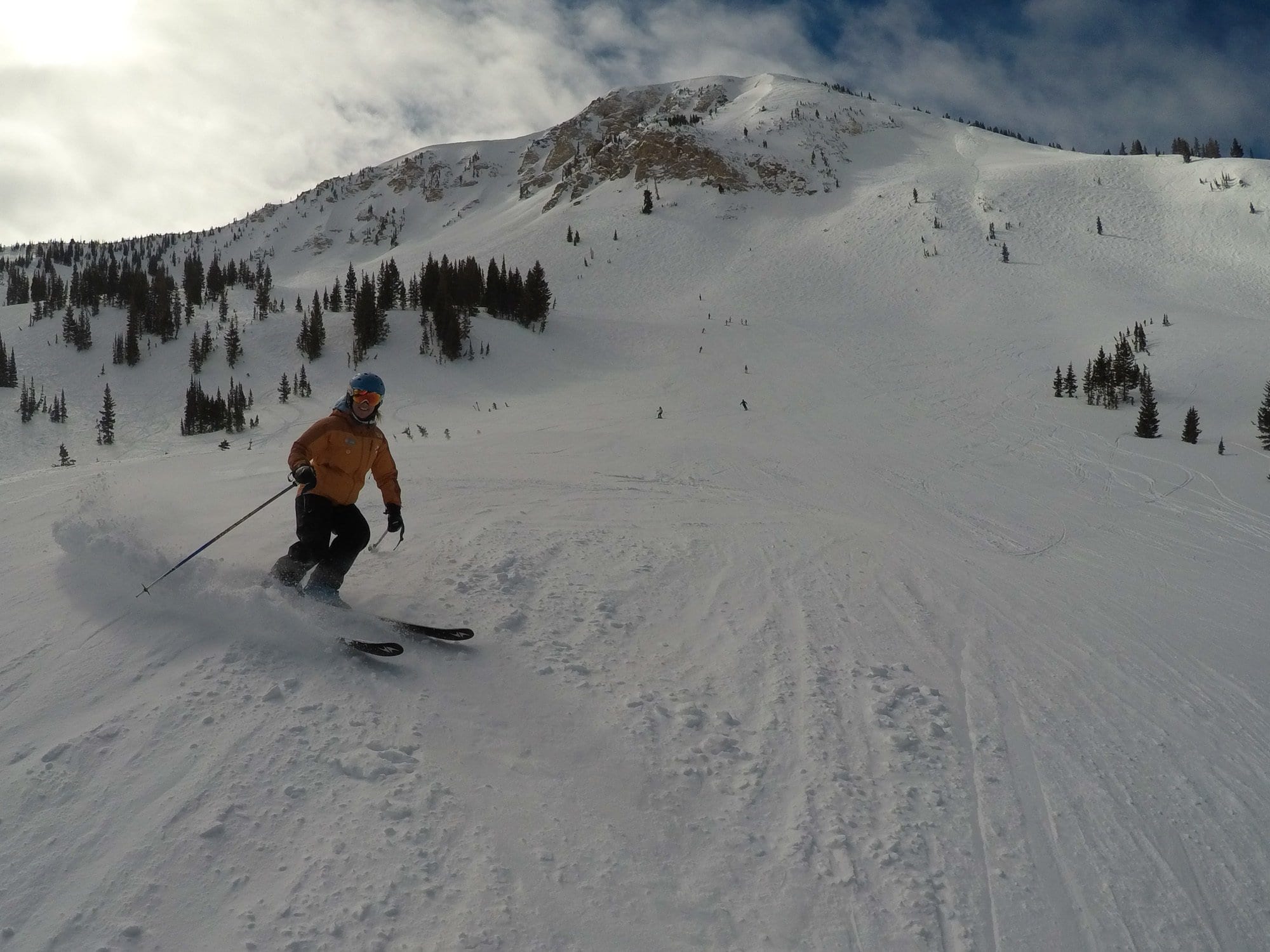 Skier coming down slopes at Alta Ski Resort in Utah