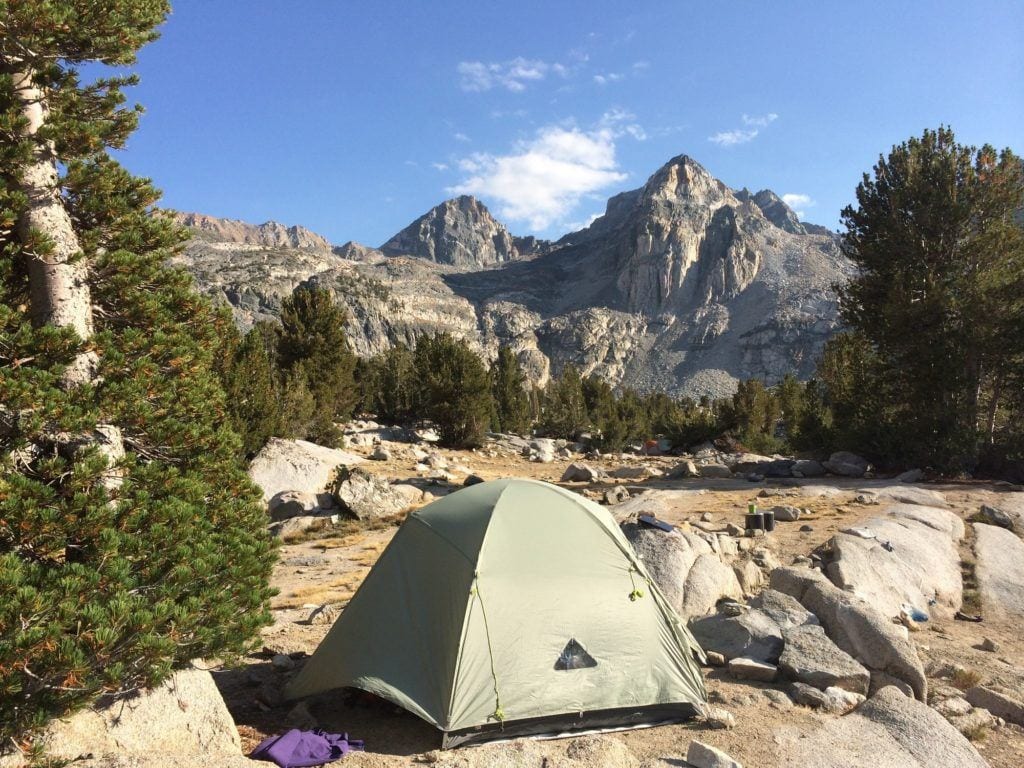 A backpacking tent is set up at Middle Rae Lake on the JMT