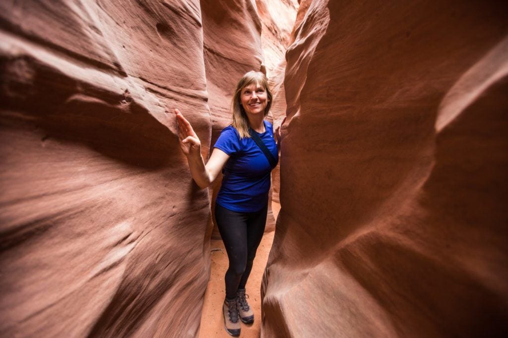 Bearfoot Theory founder Kristen Bor hiking in Spooky Slot Canyon in Escalante Utah