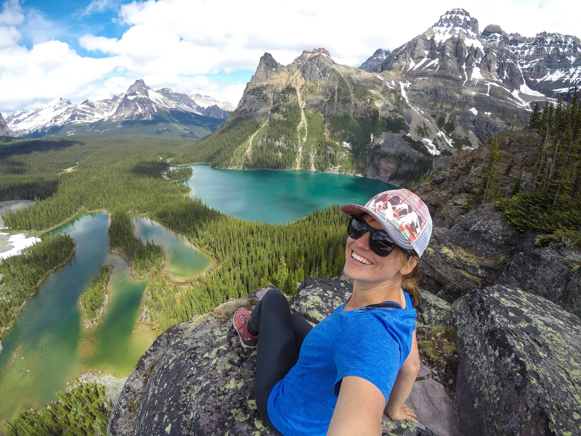 Kristen enjoying stunning views of turquoise lakes and snow-capped mountains from Opabin Prospect lookout in Yoho National Park, British Columbia