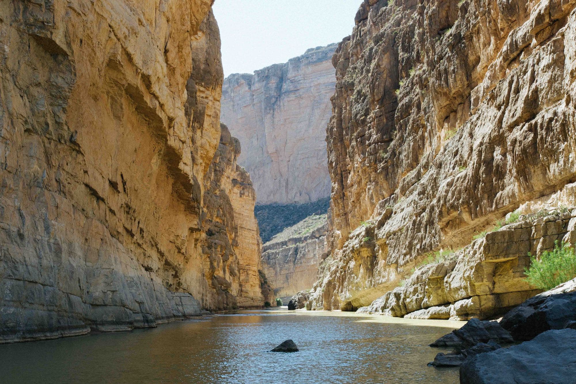 River running through pass with tall waddle cliff walls in Big Bend National Park in Texas