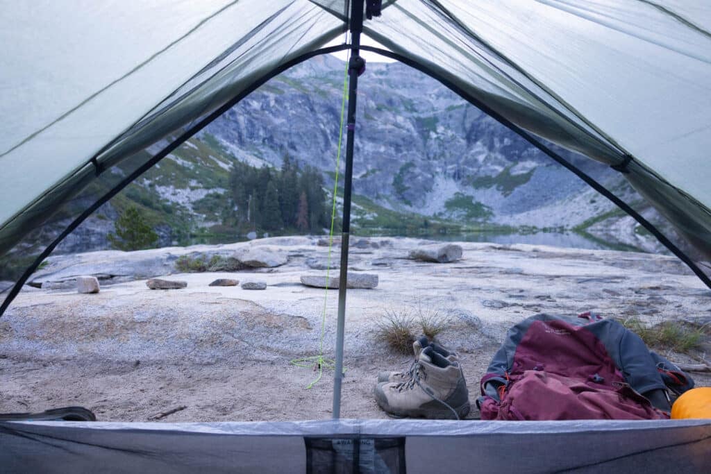 view from the inside of a zpacks triplex tent looking out at a lake in Sequoia National Park