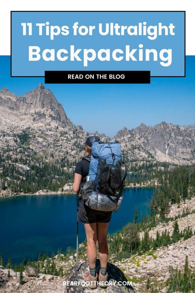 Kristen Bor with a backpacking pack in looking out over Baron Lakes in Idaho's Sawtooth Mountains. Text reads 11 Tips for Ultralight Backpacking