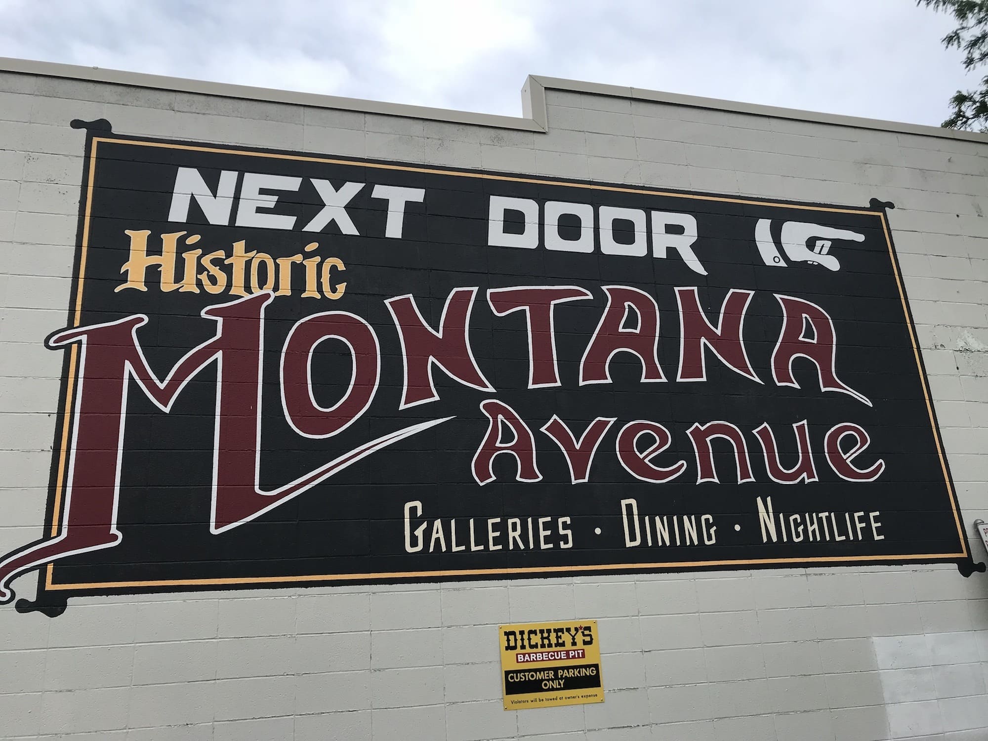 Wall mural on side of building in Billings, Montana that reads "Next Door: Historic Montana Avenue"