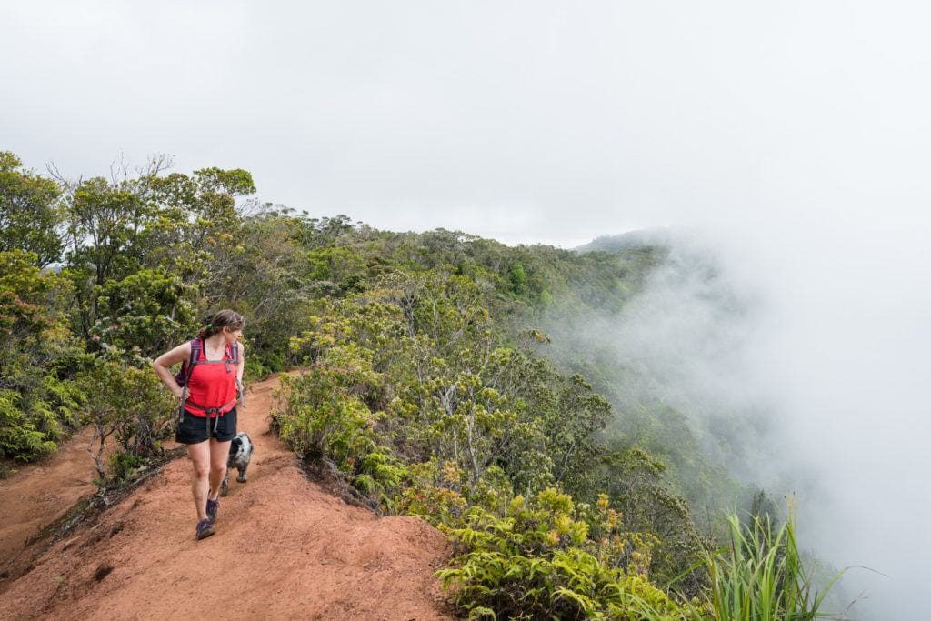 Kristen hiking on ridge-top trail in Hawaii