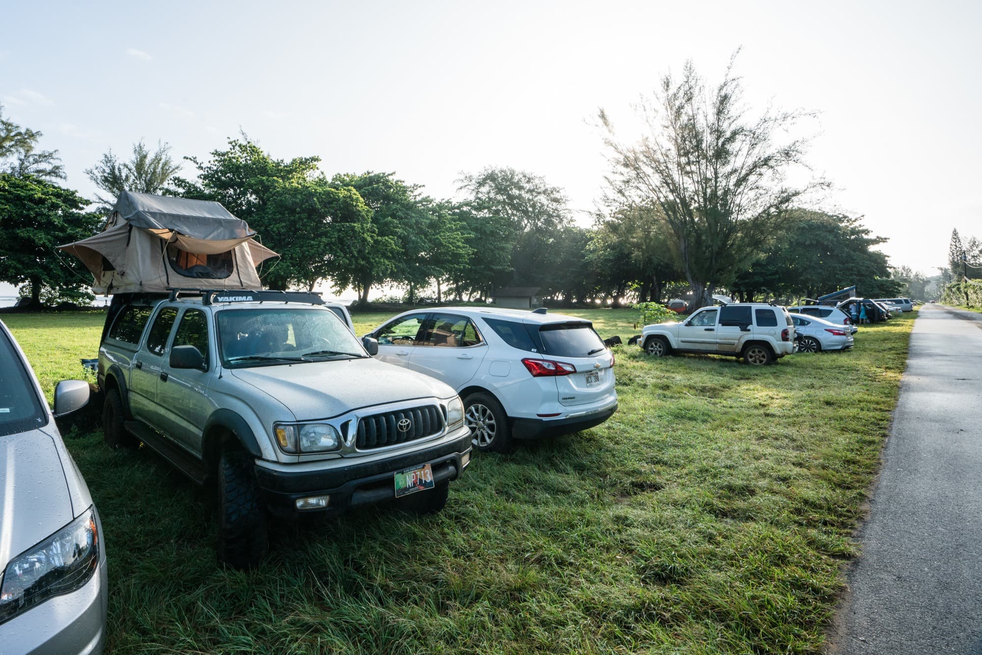 Camping at Anini Beach // Thinking about renting a 4x4 truck camper or VW-style campervan on Kauai? Read about my vanlife experiences during a recent Kauai vacation. Learn the beach campgrounds where it is legal to sleep in your car, and see if renting campervan is the right choice for your Kauai adventures.