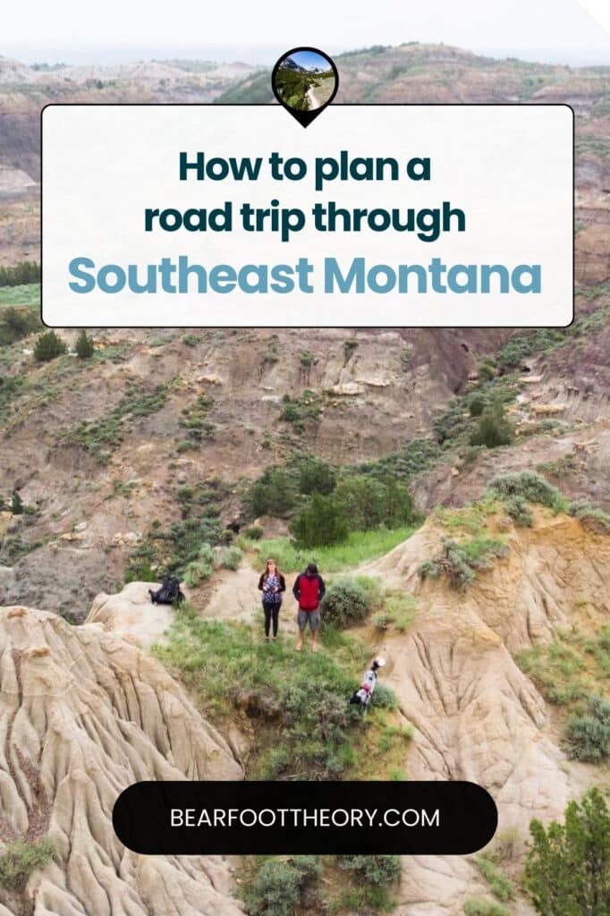 Two hikers standing on rugged, rocky terrain with a vast landscape of hills and valleys in the background. Overlay text reads, "How to plan a road trip through Southeast Montana"