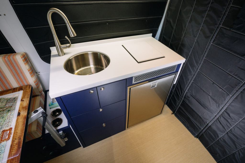 Sink and kitchen area in a converted Sprinter van