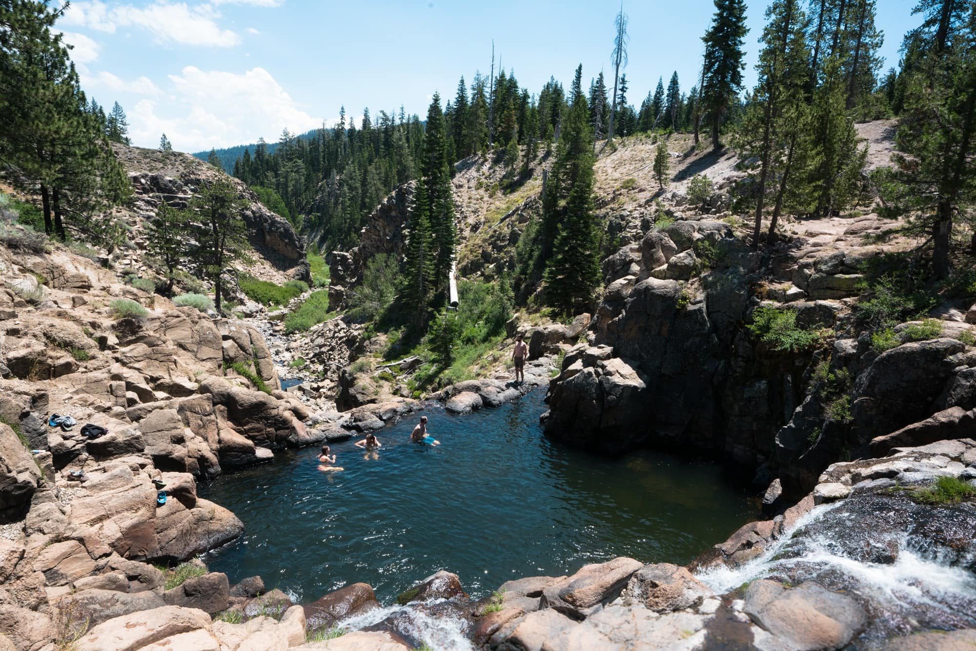 People swimming in Webber Falls near Lake Tahoe