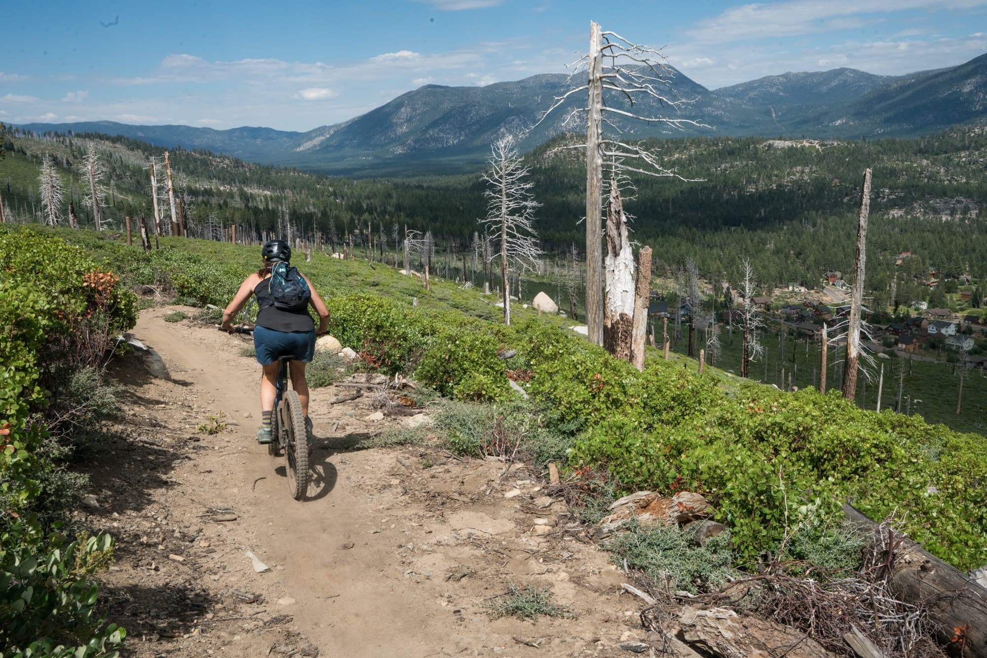 A woman mountain biking the Angora Ridge Trail in Tahoe