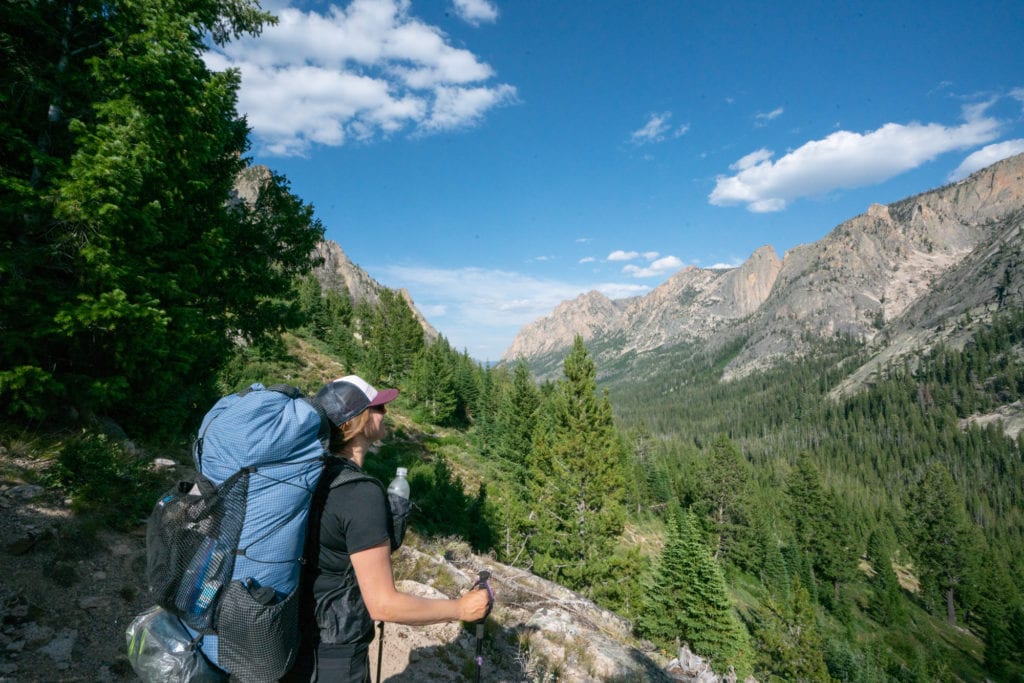 Woman carrying loaded Zpacks Arc Scout backpacking backpack on backpacking trip in the Sawtooth mountains in Idaho