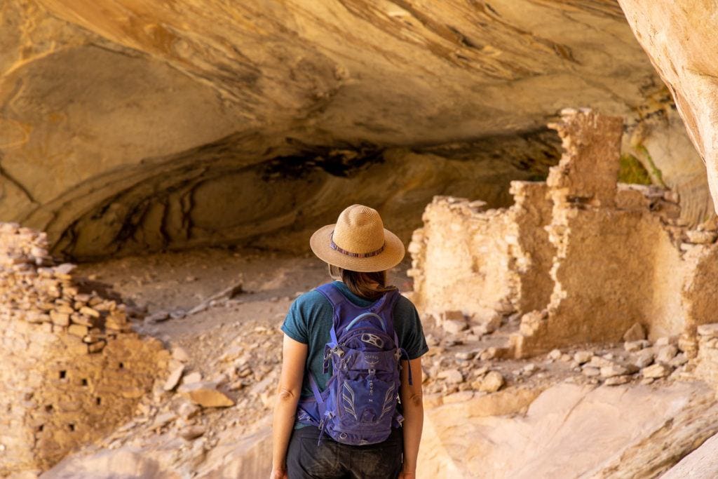 Kristen Bor looking at cliff dwellings in Bears Ears National Monument