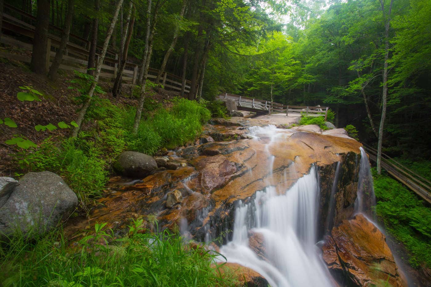 Discover the 5 most scenic White Mountains waterfall hikes in New Hampshire including how to get there and what to expect along the trail.