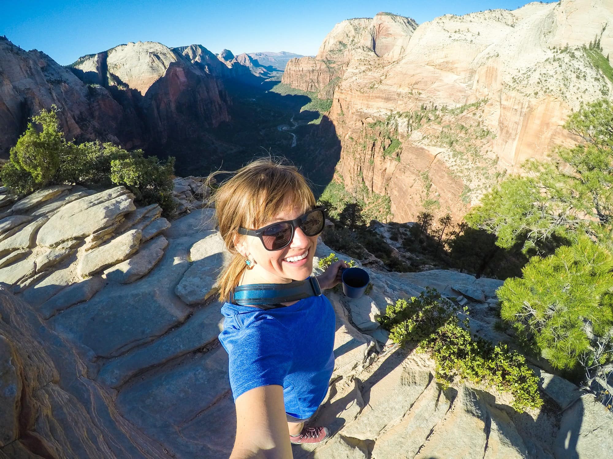 Sunrise at Angels Landing // Planning a trip to busy and popular National Park? Here are tips and tricks to beat the crowds and have an enjoyable visit in overcrowded National Parks.