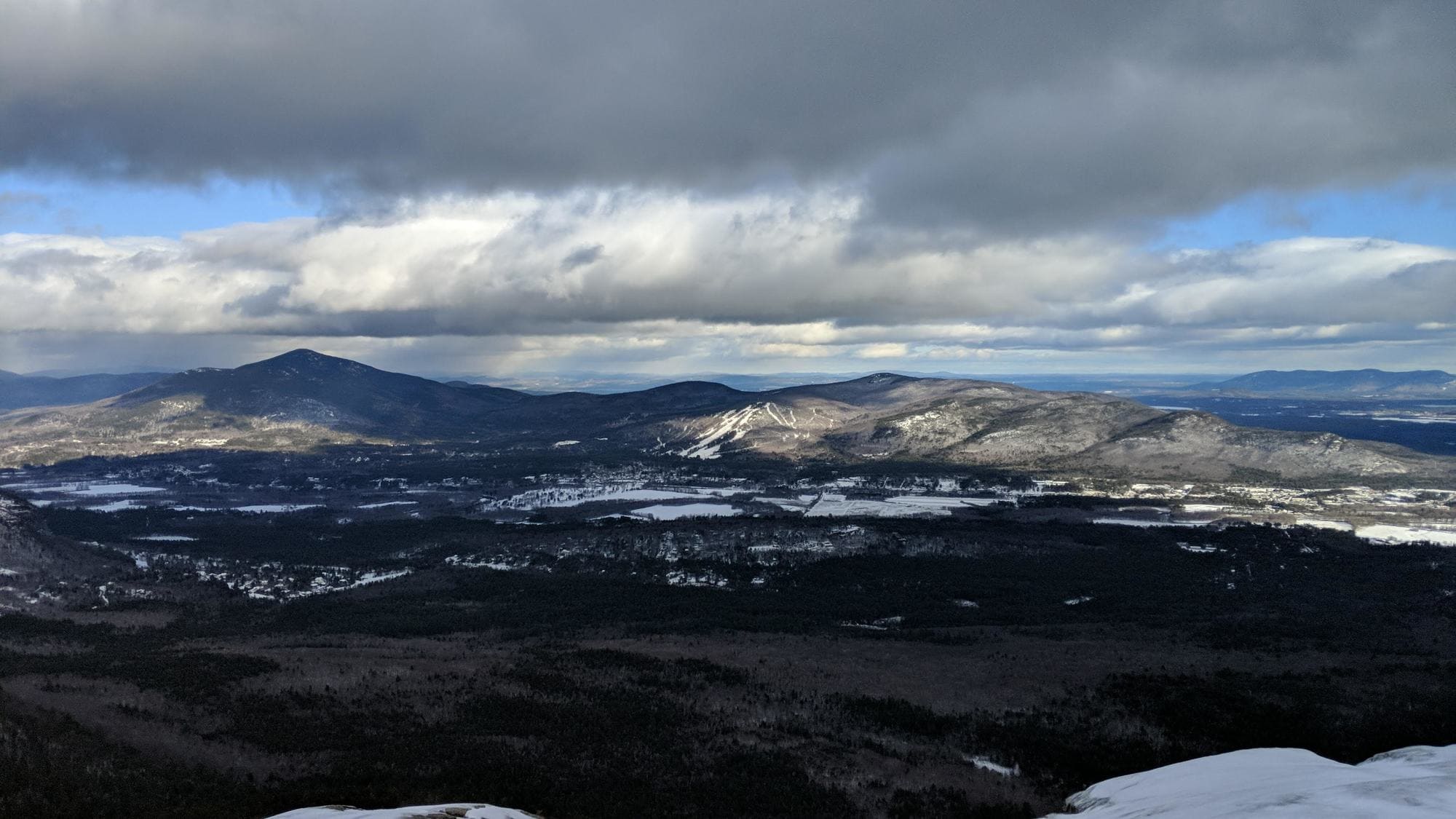 Looking for a winter hike in New Hampshire? This trail guide to hiking South Mount Mountain in the winter covers what to expect and more.