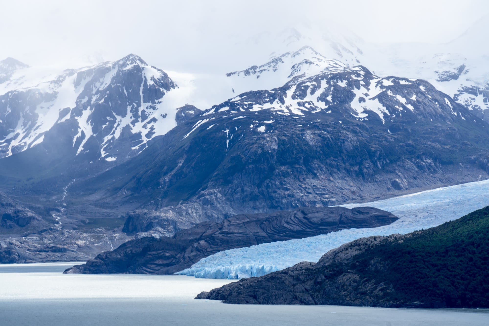 Grey Glacier // Want to hike the W Trek in Torres Del Paine? We answer all of your questions about itineraries, gear, campsites, and whether a guide is necessary. 