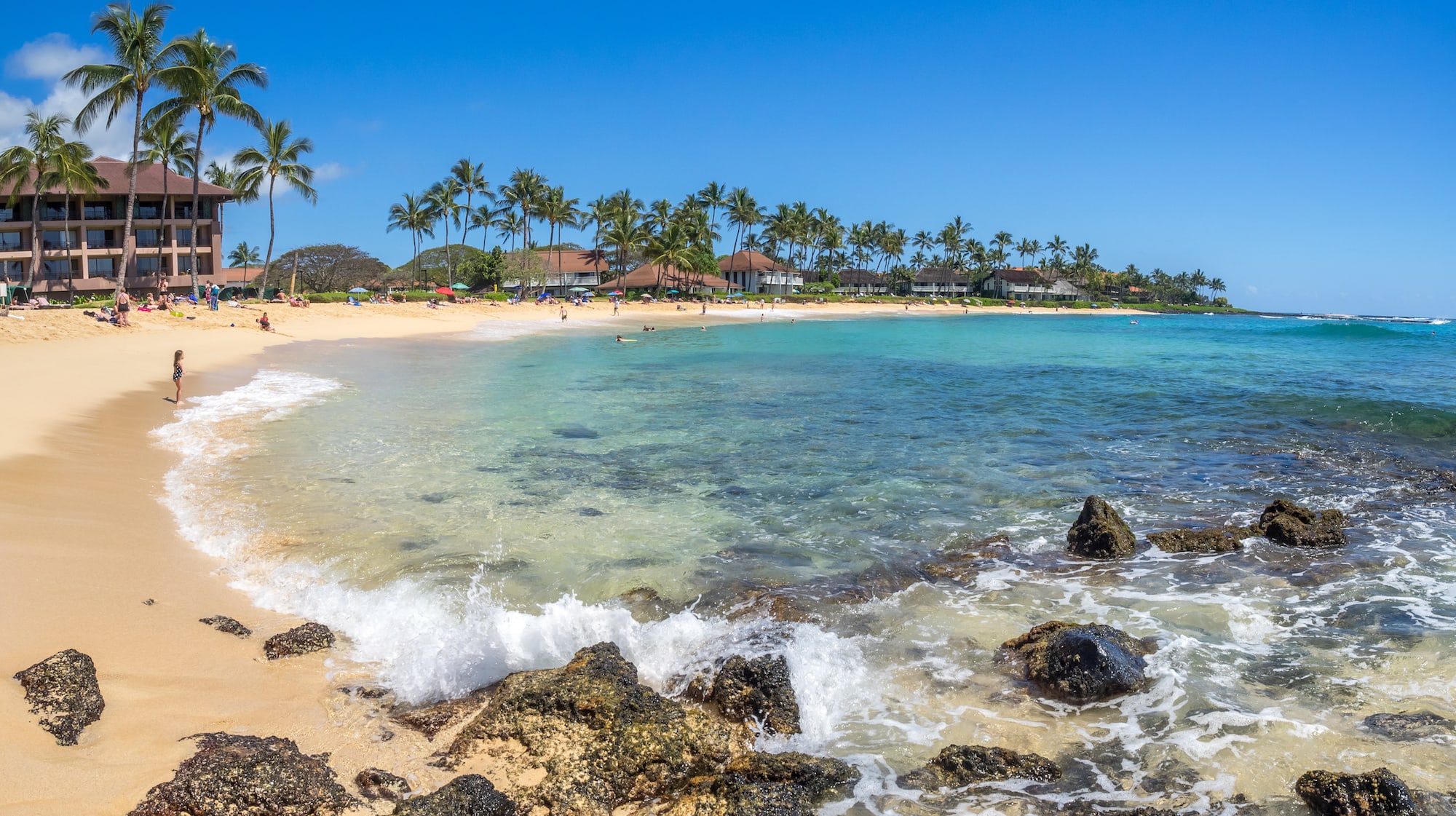 Poipu Beach // Discover the best things to do in Kauai for outdoor adventurers including scenic waterfall hikes, secluded beaches, water activities, & more!