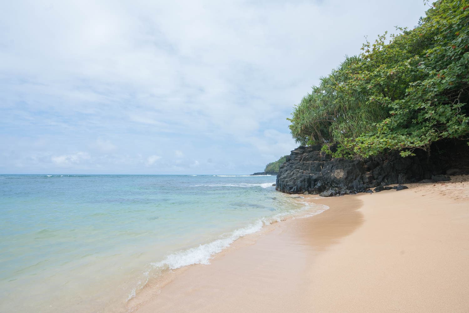 Hideaways Beach // Discover the best things to do in Kauai for outdoor adventurers including scenic waterfall hikes, secluded beaches, water activities, & more!