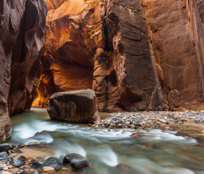 Hiking the Zion Narrows is one of the best adventures in Zion National Park. Learn how to get a permit, book a shuttle to the start & more.