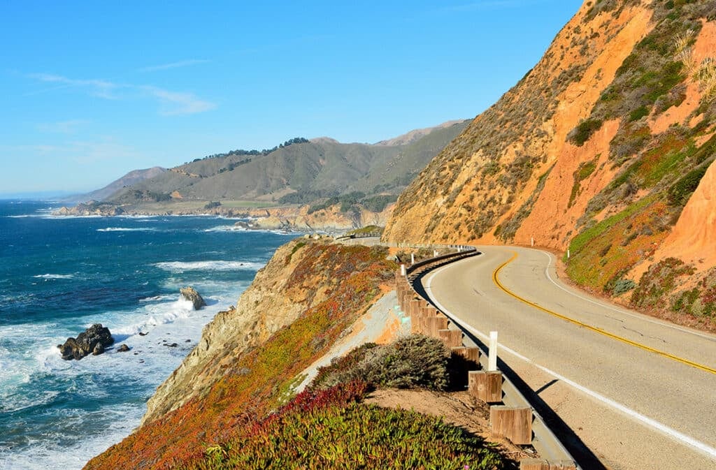 The winding Pacific highway along the Central California Coast with the ocean on the left and mountains on the right