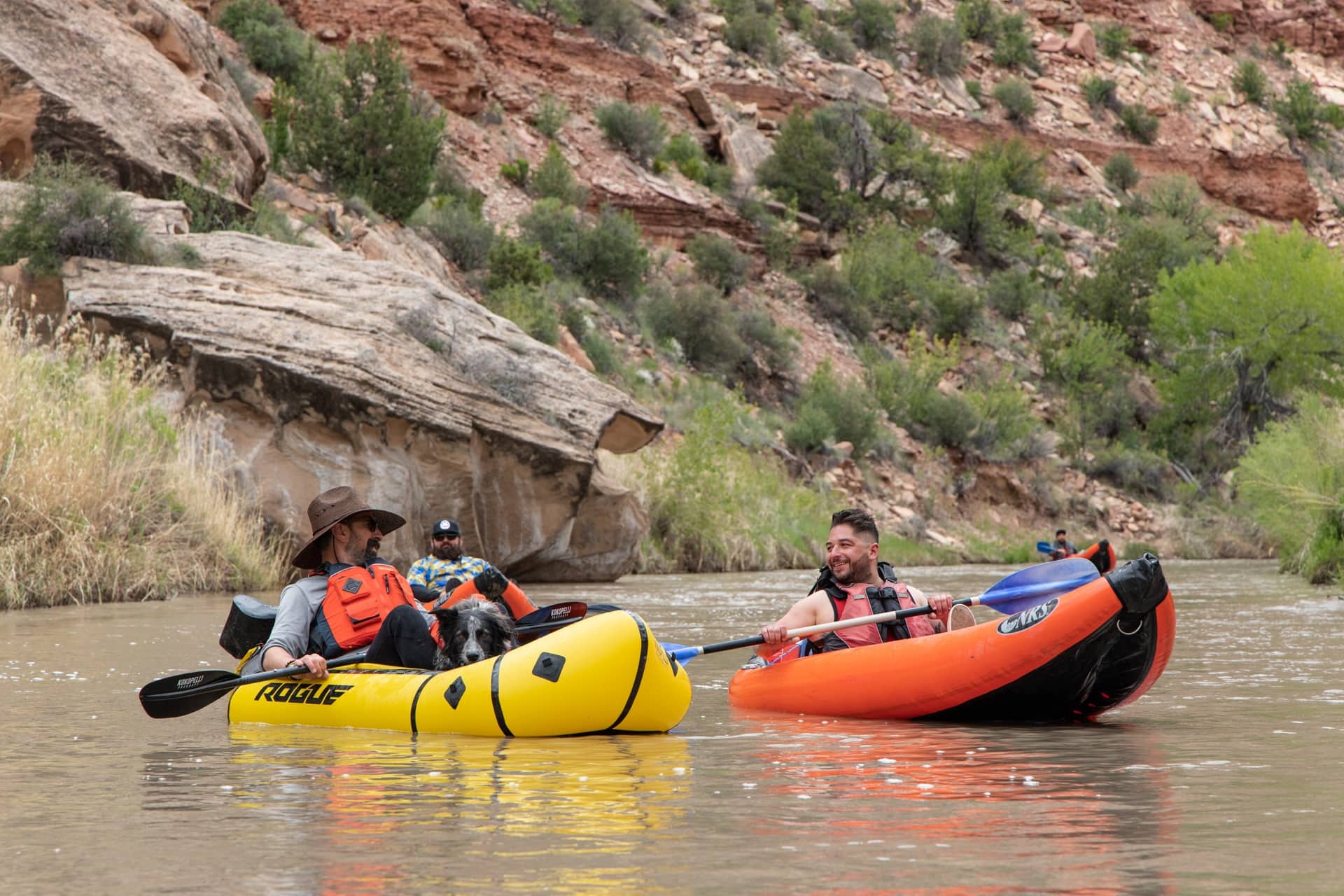 Three men each in their own packraft floating down the the San Rafael River in Utah