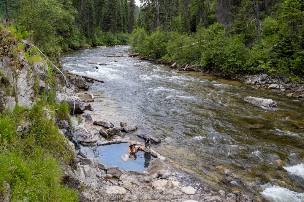 A woman sits in a natural hot spring near Cascade, Idaho