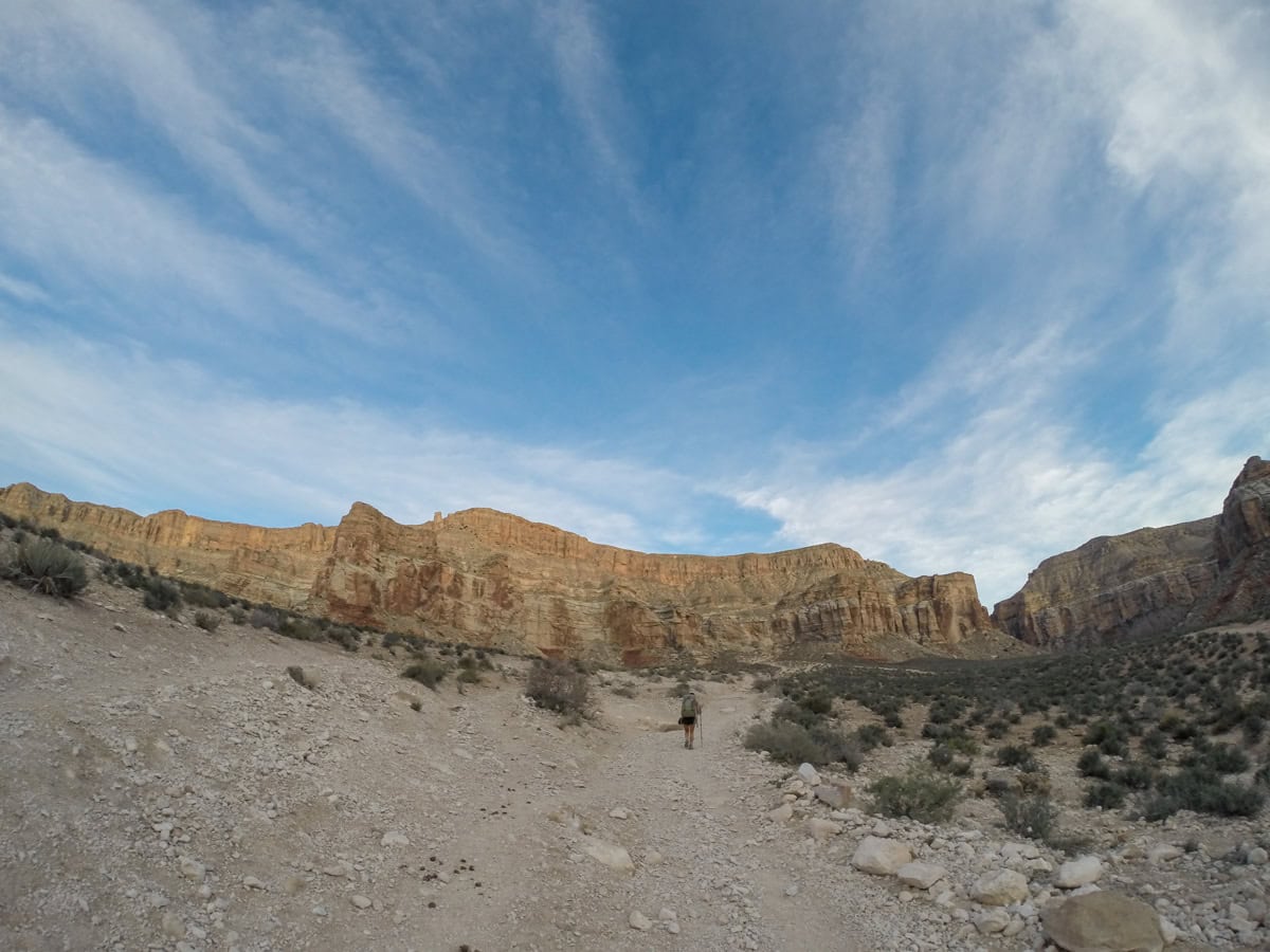 Hiker on a desert trail to Havasu Falls