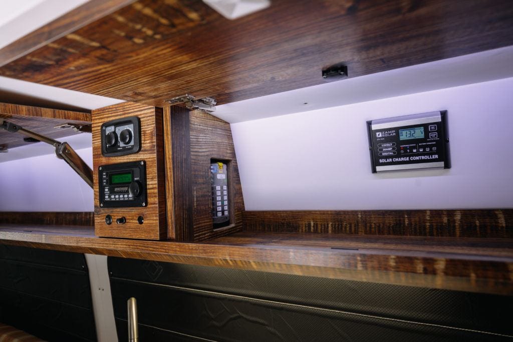 solar charge controller inside a camper van cabinet