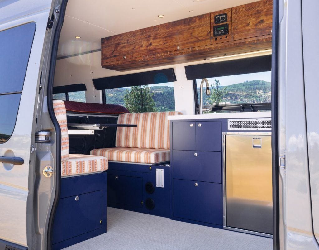 the interior of a campervan from the view of the side door