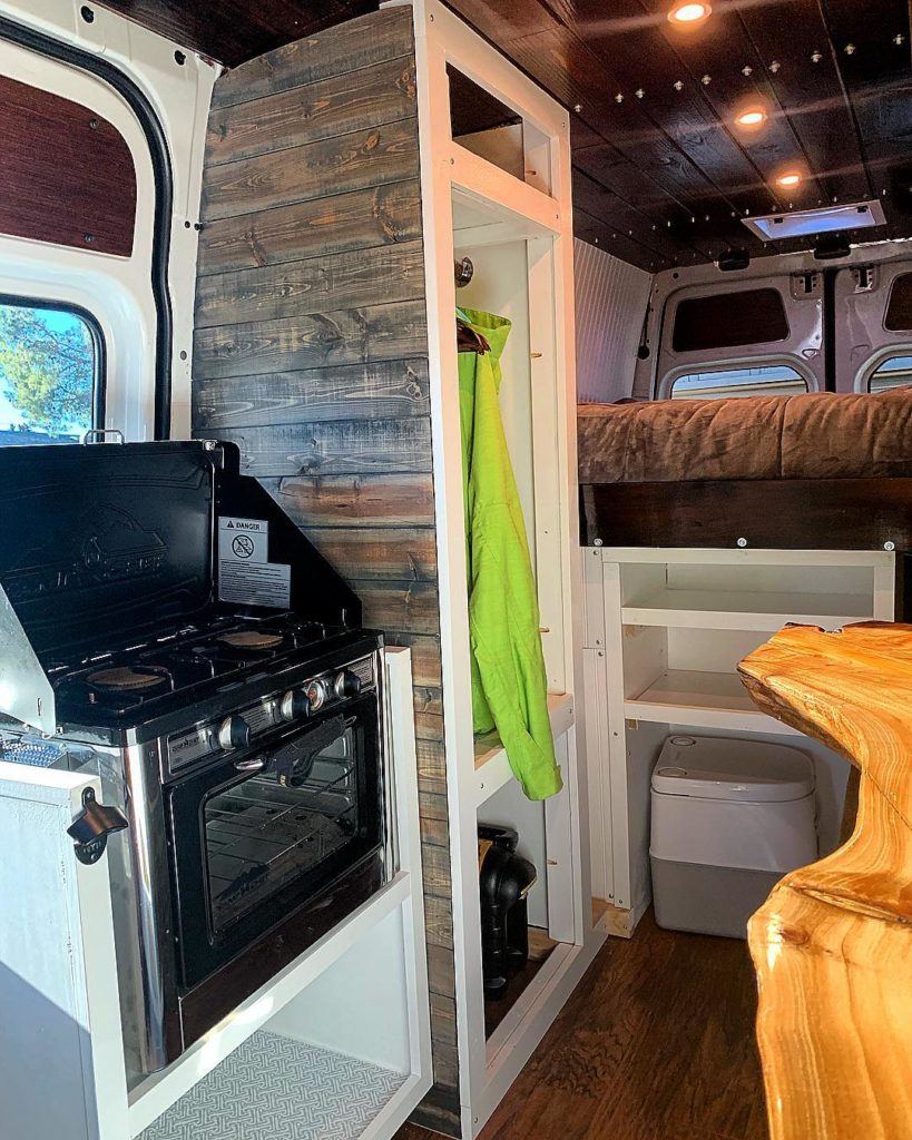 Converted campervan kitchen with campervan oven and stovetop