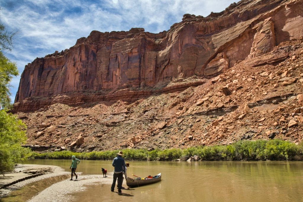 Get key planning tips for canoeing Labyrinth Canyon on the Green River with info on permits, shuttles, gear, bugs, river flow, launch points, and camping.